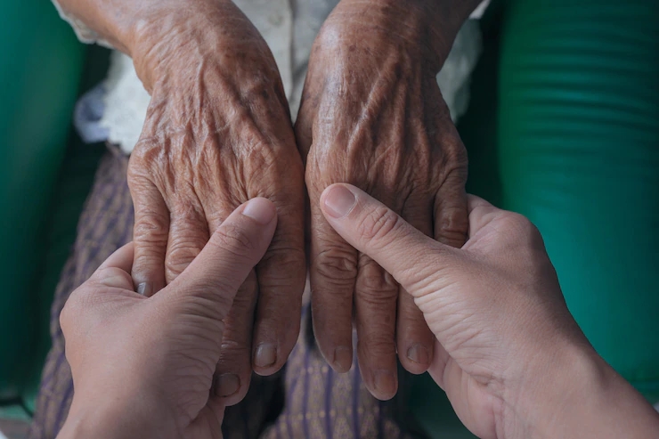 young-woman-holding-elderly-woman-s-hand_1150-12496.webp.jpg