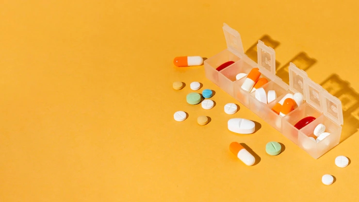 pills-box-yellow-background_23-2148537721.webp.jpg